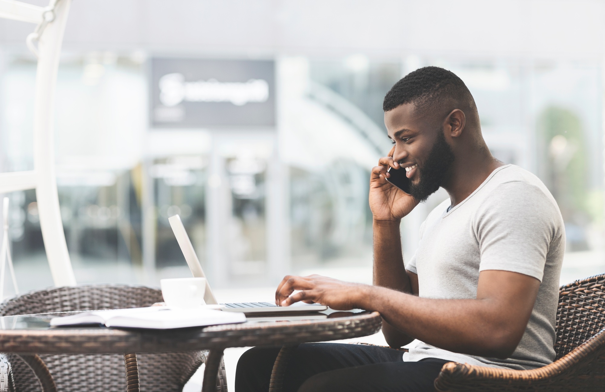 African guy talking with friend and planning the date of party