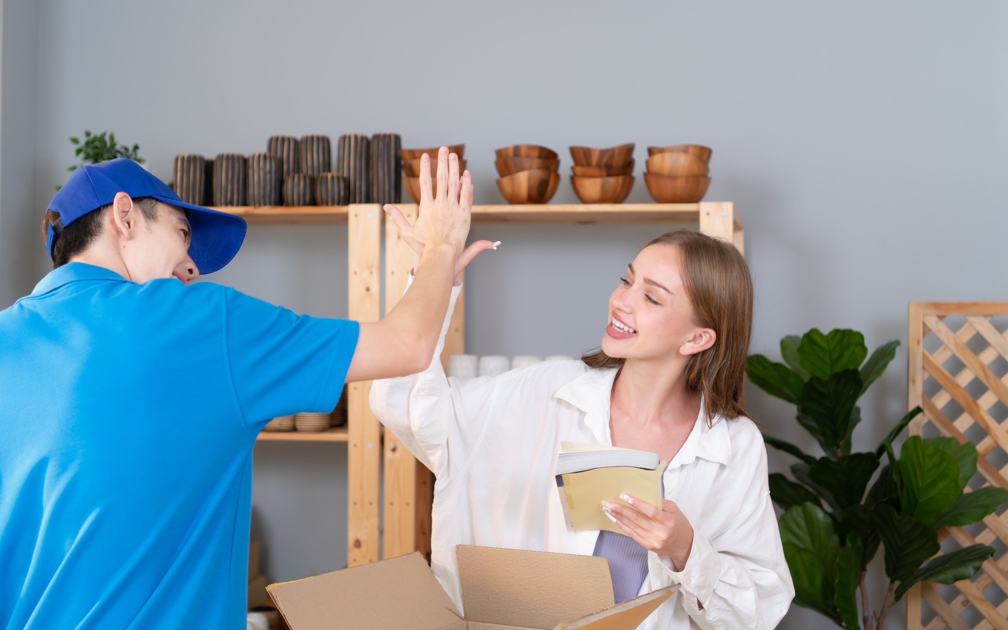 Delivery man assists the customer to record images to check the product after delivery