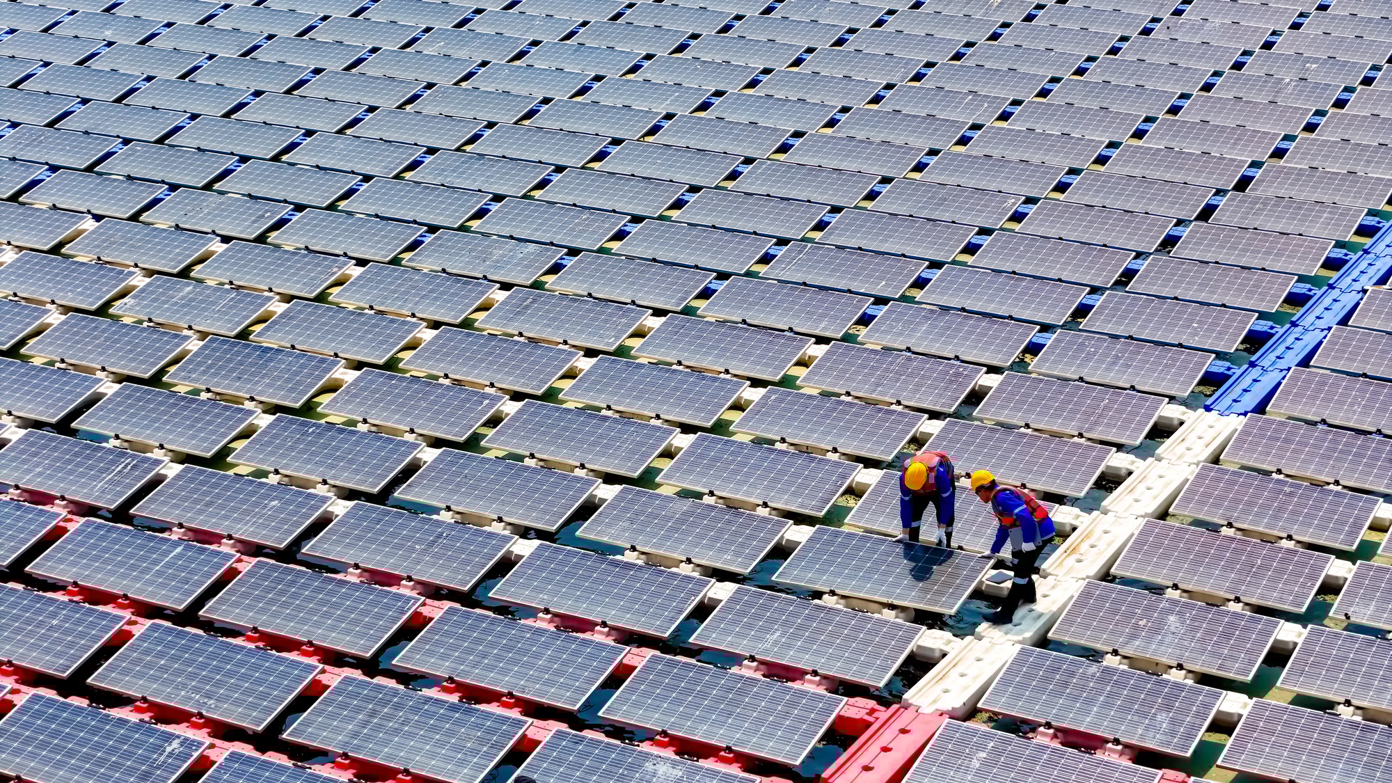 Floating solar panels providing renewable energy. Aerial view floating on solar cells and