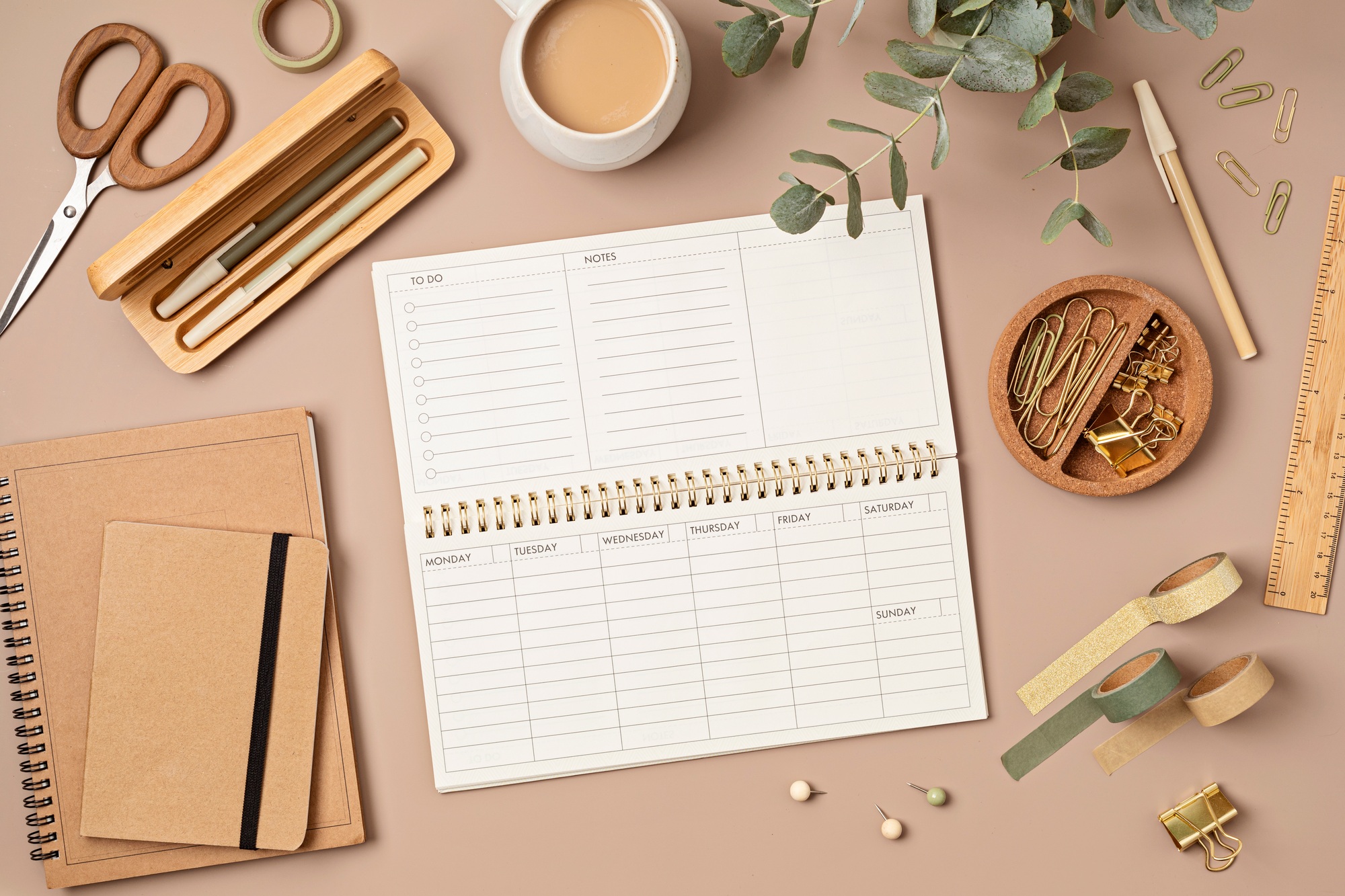 Mockup of weekly planner and office stationery